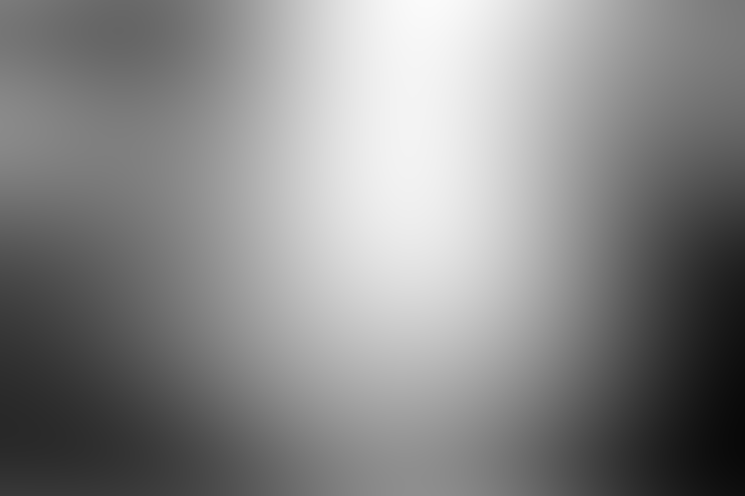 Grey gradient background. White and black foil backdrop.